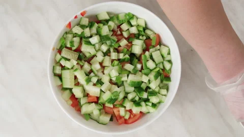 Vegetable salad. Add salt, pepper and mayonnaise to the sliced salad, mix well. Stock Footage 148931395