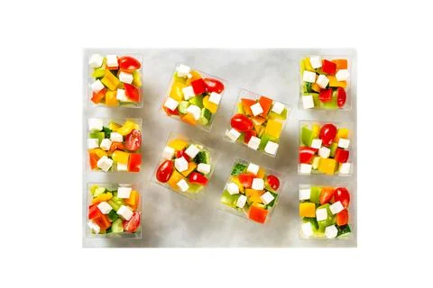 Vegetable salad with avocado in a plastic boxes, catering food Stock Photos