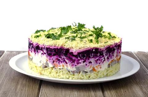 Vegetable salad with beetroot and round herring. Studio Photo Stock Photos