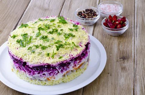 Vegetable salad with beetroot and round herring. Studio Photo Stock Photos
