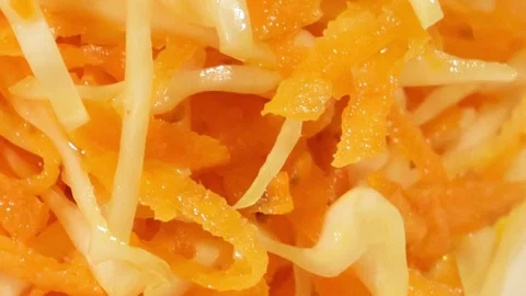 Vegetable salad of carrot and cabbage on wooden background close up. Stock Footage 74508207