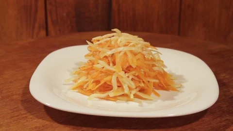 Vegetable salad of carrot and cabbage on wooden background close up. Stock Footage 74508253