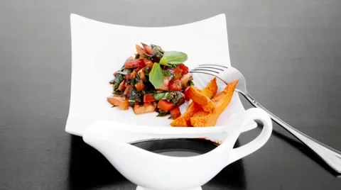 Vegetable salad : cherry tomatoes and basil with sweet baked potato Stock Footage 57508951