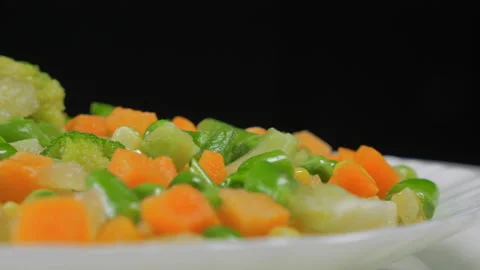 Vegetable salad closeup on a plate rotates Stock Footage 88438200
