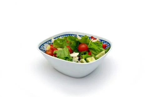 Vegetable salad from cucumbers, pepper, tomatoes, onions Stock Photos