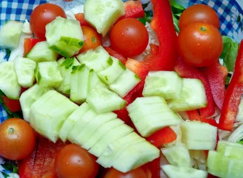 Vegetable salad from cucumbers, pepper, tomatoes, onions Stock Photos