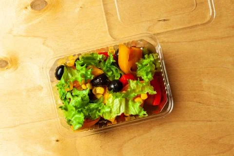 Vegetable salad in a plastic box. Stock Photos