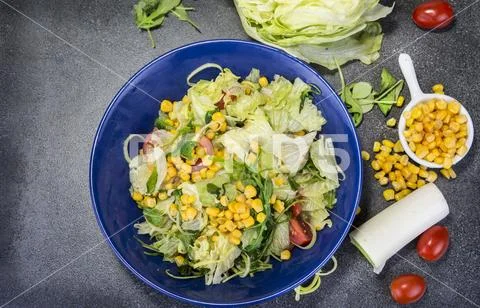 Vegetable salad on the plate with corn Stock Photos