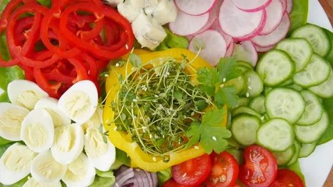 Vegetable salad with quail eggs. Stock Footage 238722102