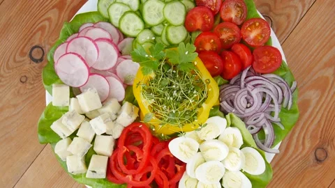 Vegetable salad with quail eggs. Stock Footage 239712716