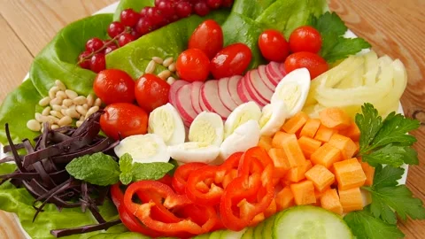 Vegetable salad with quail eggs. Stock Footage 239888155