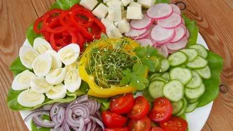Vegetable salad with quail eggs. Stock Footage 239977153