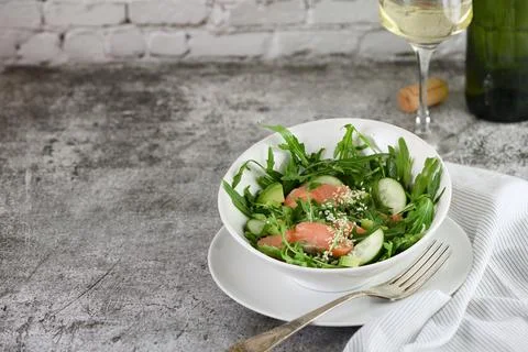 Vegetable salad with red fish. Stock Photos