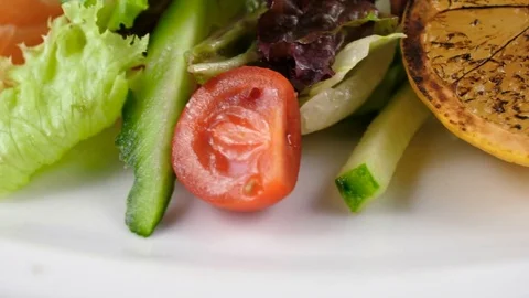 Vegetable salad with salmon, close-up view, camera moves from bottom to top Stock Footage 81002866