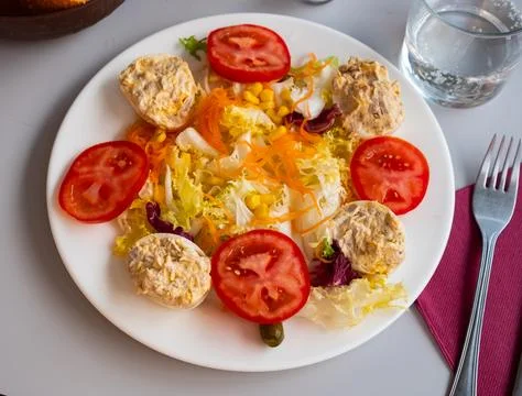 Vegetable salad with stuffed egg halves Stock Photos