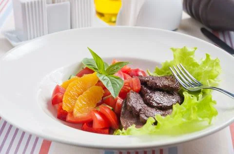 Vegetable salad with tasty beef and oranges Stock Photos