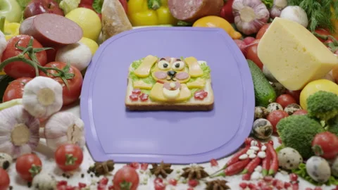 Vegetable sandwich in dog shape on violet chopping board Stock Footage 238468423