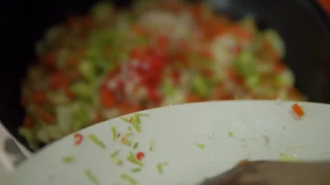 Vegetable saute pouring on pan Video stock 146777694