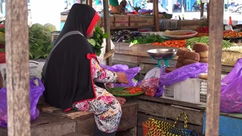 Vegetable sellers or traders are cleaning or sorting chilies Stock Footage 208306096