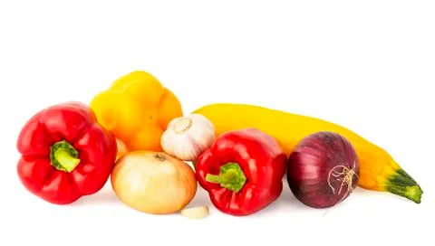 Vegetable set of bright ripe appetizing fruit peppers onion zucchini and garl Stock Photos