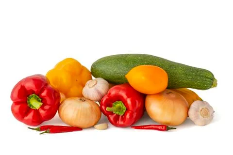 Vegetable set of bright ripe appetizing fruit peppers onion zucchini and garl Stock Photos