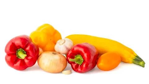 Vegetable set of bright ripe appetizing fruit peppers onion zucchini and garl Stock Photos