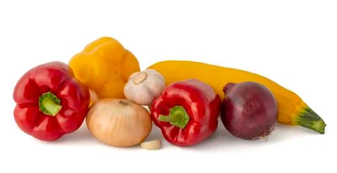 Vegetable set of bright ripe appetizing fruit peppers onion zucchini and garl Stock Photos