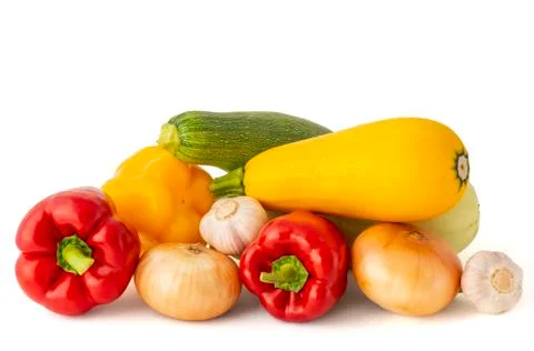 Vegetable set of bright ripe appetizing fruit peppers onion zucchini and garl Stock Photos