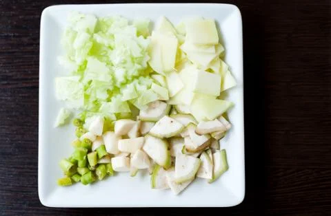 Vegetable sliced on white dish Stock Photos