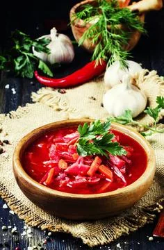 Vegetable soup with beets, rustic style, selective focus Stock Photos