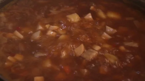 Vegetable soup boiling high heat Stock Footage 78980895