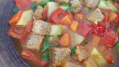 Vegetable soup close up rotates slow motion Stock Footage 108336891