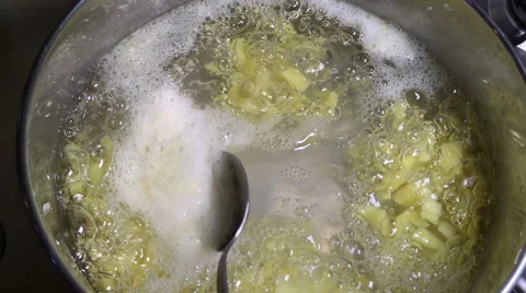 Vegetable soup cooking in the kitchen Stock Footage 67561681