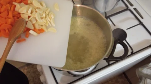 Vegetable soup cooks in a pan. Stock Footage 122210767