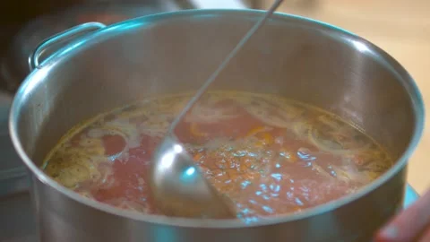Vegetable soup cooks in a pan Stock Footage 134471450