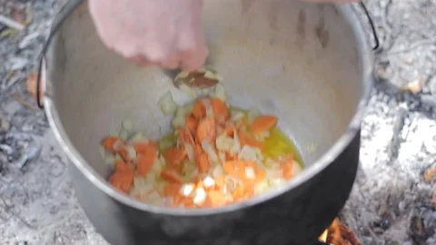 Vegetable soup outdoors in a cauldron Stock Footage 88808843