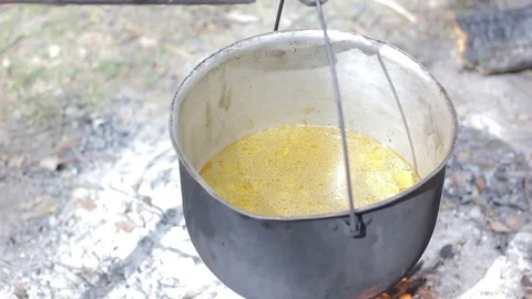 Vegetable soup outdoors in a cauldron Stock Footage 88809866