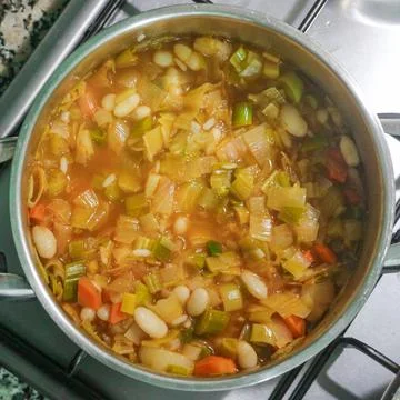 Vegetable soup on pan, top view Stock Photos