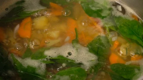 Vegetable soup. Vegetables in boiling water. Potatoes, carrots, onions, peas Video stock 121853977