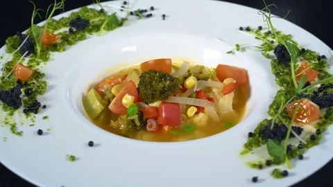 Vegetable soup in a white ceramic dish Stock Footage 82080712