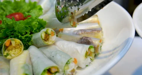Vegetable spring rolls Spring roll with shrimps and vegetables inside close-up Stock Footage 276571739