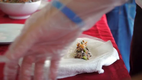 Vegetable springrolls in the making. Learning how to make vietnamese Stock Footage 129867608