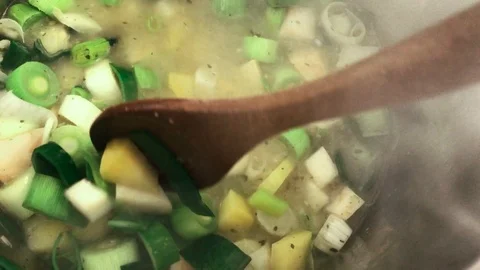 Vegetable stew being stirred with a spoon Stock Footage 94202928