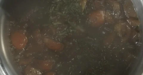 Vegetable stew is boiling in a saucepan with tomatoes, spices and seasoning 動画素材 250784967