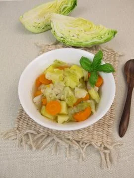 Vegetable stew with cone cabbage in soup bowl Stock Photos