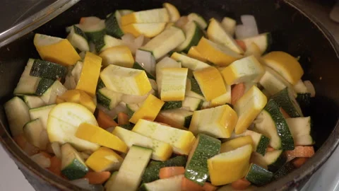 Vegetable stew is cooked in a pan Stock Footage 137576348