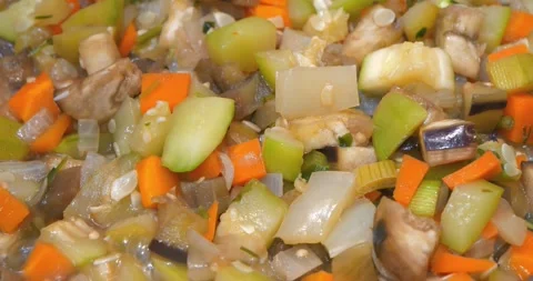 Vegetable stew is cooked on a stove. Ragout is cooked, close-up. Vegetable stew Stock Footage 319905629