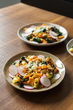 Vegetable stew in a plate at the modern kitchen Stock Photos
