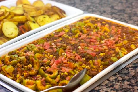 Vegetable stew with red beans on a white dish in a restaurant Stock Photos