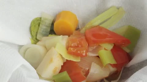 Vegetable stock being sieved Stock Footage 24667381